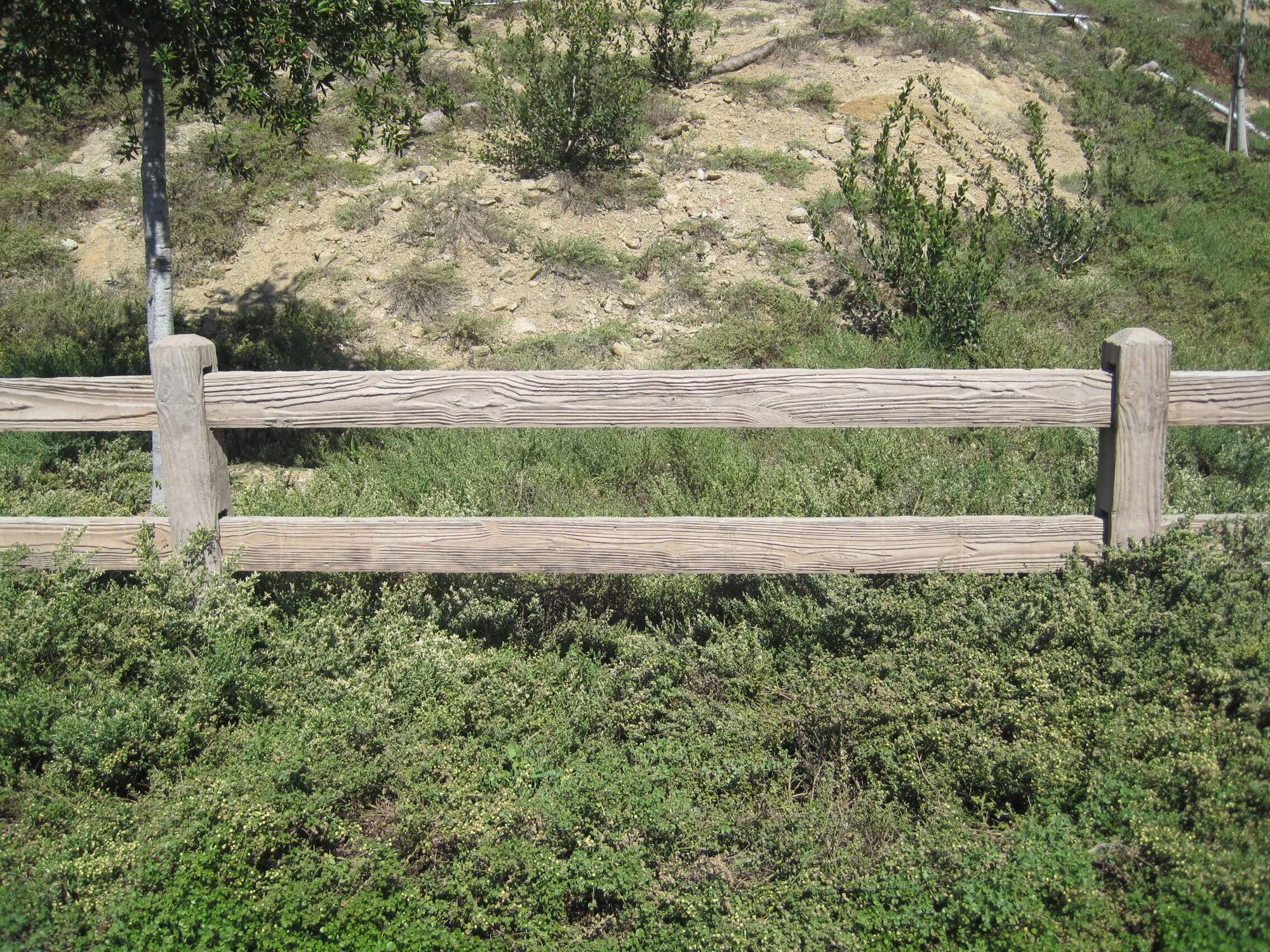 wooden concrete rail fence